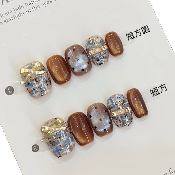 Handmade brown and blue Chanel-style high-end plaid short nails with bow, glass beads, and cat-eye effect for the new autumn and winter season